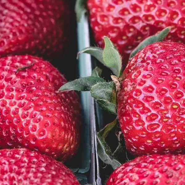 Thumb applied to the strawberries photo